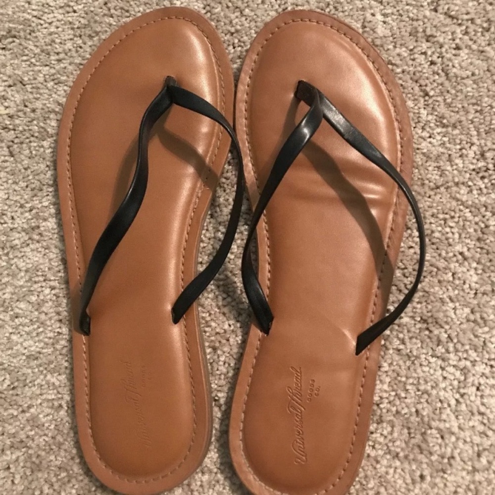 Black faux leather flip flops